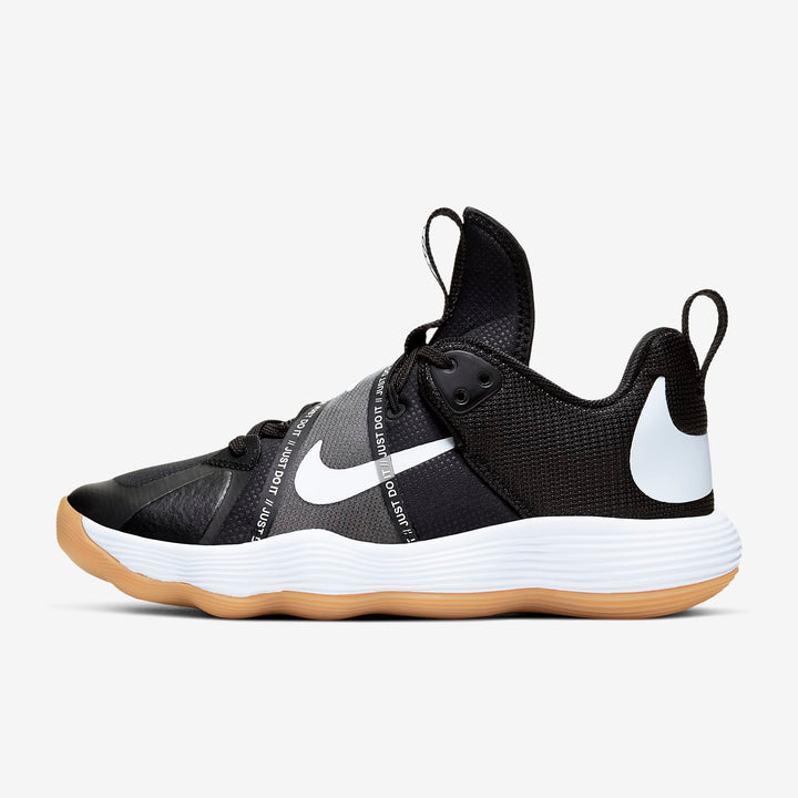 A side-angle view of Nike React Hyperset indoor unisex footwear showcasing the breathable mesh upper React foam midsole and durable outsole designed for court performance placed on a clean background.