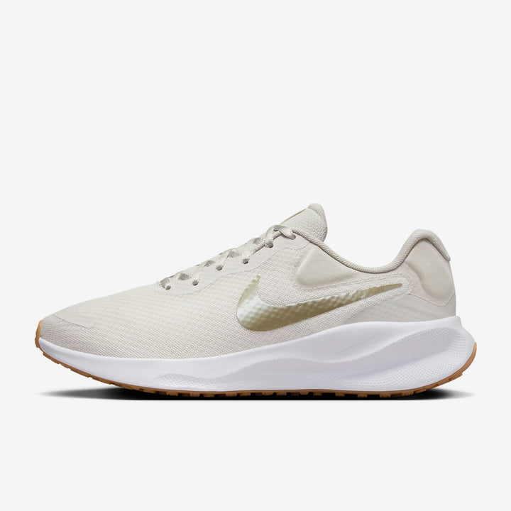 A side-angle view of Nike women’s lace-up running shoes showcasing the sleek profile, cushioned sole, and iconic Nike swoosh, set against a clean background for a modern look